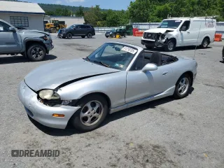2000 Mazda MX-5 Miata with VIN JM1NB3532Y0151213, listed as a Copart auction lot 61210705 with 148,913 mi miles and Salvage title. Bid and sale history available at DreamBid. Image 1.