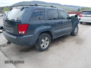 2007 Jeep Grand Cherokee Laredo with VIN 1J8GR48K07C692148, listed as a IAAI auction lot 42079608 with 245,605 mi miles. Bid and sale history available at carsss.com. Image 4.