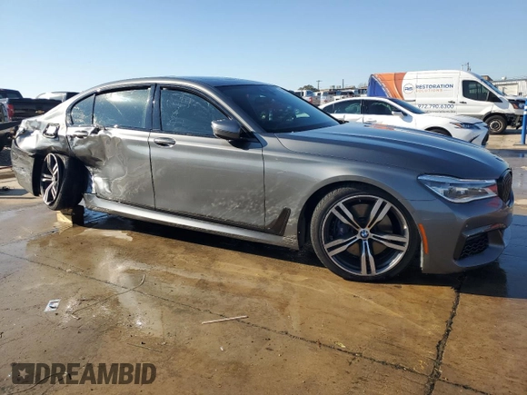 2019 BMW 7 Series 750i with VIN WBA7F0C59KGM25051, listed as a Copart auction lot 87285534 with Not Provided miles and Salvage Title. Bid and sale history available at DreamBid. Image 4.