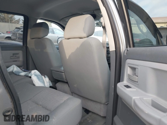 2007 Dodge Dakota SLT z VIN 1D7HW48P57S216313, wystawiony jako IAAI lot #41319321 z przebiegiem 116 712 mil mil oraz . Historia ofert i sprzedaży dostępna na DreamBid. Obrazek 8.
