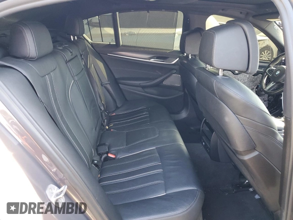 2022 BMW 5 Series M550i xDrive z VIN WBA13BK0XNCJ23778, wystawiony jako Copart lot #76946634 z przebiegiem 24 889 mil mil oraz Szkoda całkowita • Salvage title. Historia ofert i sprzedaży dostępna na DreamBid. Obrazek 10.
