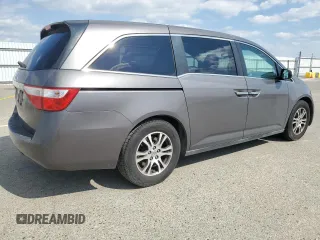 2011 Honda Odyssey EX-L with VIN 5FNRL5H61BB056652, listed as a Copart auction lot 54774015 with 233,125 mi miles and Salvage Title. Bid and sale history available at DreamBid. Image 3.