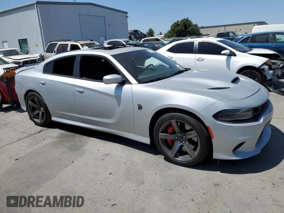 2019 Dodge Charger SRT Hellcat with VIN 2C3CDXL96KH588025, listed as a Copart auction lot 64705614 with 49,659 mi miles and Salvage Title. Bid and sale history available at DreamBid. Image 4.