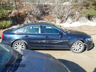 2014 Audi A6 Premium Plus z VIN WAUFGAFC4EN124454, wystawiony jako IAAI lot #41653231 z przebiegiem 145 751 mil mil oraz . Historia ofert i sprzedaży dostępna na DreamBid. Obrazek 13.