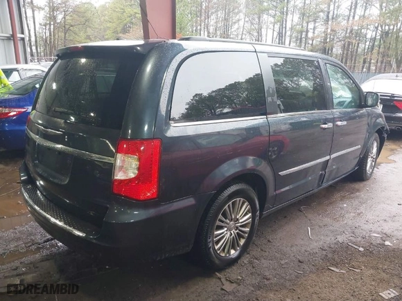 2014 Chrysler Town & Country Touring-L 30th Anniversary with VIN 2C4RC1CG1ER249935, listed as a IAAI auction lot 41553454 with 157,184 mi miles. Bid and sale history available at carsss.com. Image 4.