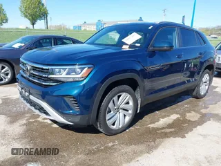 2021 Volkswagen Atlas SE z VIN 1V2KE2CA7MC220524, wystawiony jako IAAI lot #42017287 z przebiegiem 29 380 mil mil oraz . Historia ofert i sprzedaży dostępna na DreamBid. Obrazek 18.