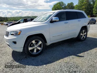 2015 Jeep Grand Cherokee Overland z VIN 1C4RJFCG8FC166502, wystawiony jako Copart lot #56854675 z przebiegiem 155 740 mil mil oraz Szkoda całkowita • Salvage title. Historia ofert i sprzedaży dostępna na DreamBid. Obrazek 1.