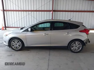 2017 Ford Focus Titanium z VIN 1FADP3N2XHL288103, wystawiony jako IAAI lot #42573844 z przebiegiem 128 952 mil mil oraz . Historia ofert i sprzedaży dostępna na DreamBid. Obrazek 15.