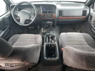 1998 Jeep Grand Cherokee Laredo with VIN 1J4GZ48S1WC165851, listed as a Copart auction lot 84110044 with 306,484 mi miles and Salvage Title. Bid and sale history available at carsss.com. Image 8.
