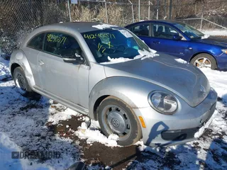 2012 Volkswagen Beetle 2.5L PZEV with VIN 3VWJP7AT4CM601556, listed as a IAAI auction lot 41240071 with 113,338 mi miles. Bid and sale history available at carsss.com. Image 1.
