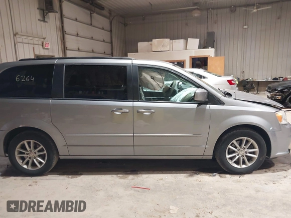2014 Dodge Grand Caravan SXT z VIN 2C4RDGCGXER263963, wystawiony jako IAAI lot #41956264 z przebiegiem 138 815 mil mil oraz . Historia ofert i sprzedaży dostępna na DreamBid. Obrazek 13.