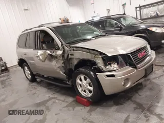 2003 GMC Envoy SLT with VIN 1GKDT13S932395367, listed as a IAAI auction lot 41544810 with 142,012 mi miles. Bid and sale history available at carsss.com. Image 1.