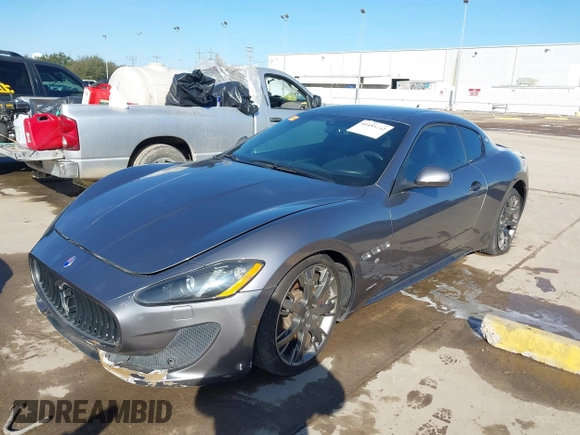 2013 Maserati GranTurismo Sport with VIN ZAM45VLA7D0074506, listed as a IAAI auction lot 41455462 with 34,292 mi miles and . Bid and sale history available at DreamBid. Image 2.
