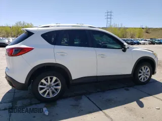 2014 Mazda CX-5 Touring z VIN JM3KE4CYXE0393443, wystawiony jako Copart lot #54738705 z przebiegiem 68 220 mil mil oraz Szkody całkowita. Historia ofert i sprzedaży dostępna na DreamBid. Obrazek 3.