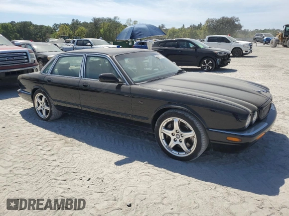 2003 Jaguar XJ with VIN SAJDA15B83MF58887, listed as a Copart auction lot 51057895 with 189,770 mi miles and Clean title. Bid and sale history available at DreamBid. Image 4.