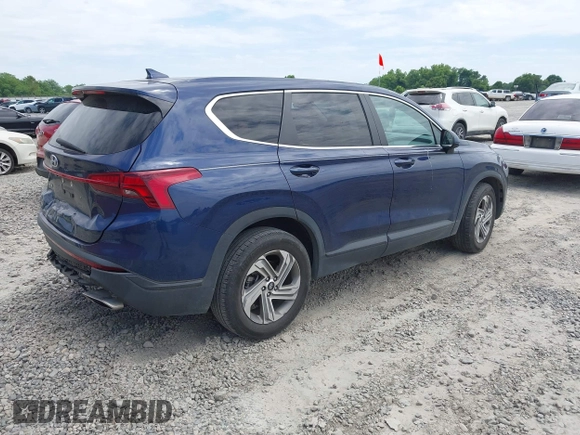 2021 Hyundai Santa Fe SE with VIN 5NMS14AJ2MH323542, listed as a IAAI auction lot 42182576 with 69,385 mi miles and . Bid and sale history available at DreamBid. Image 4.