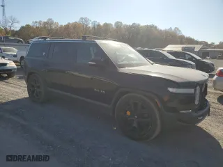 2022 Rivian R1S Launch Edition with VIN 7PDSGABL6NN001531, listed as a Copart auction lot 77143684 with 27,241 mi miles and Salvage Title. Bid and sale history available at carsss.com. Image 4.