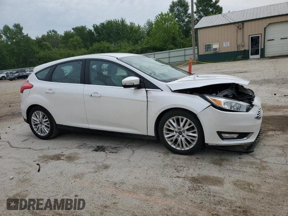 2016 Ford Focus Titanium z VIN 1FADP3N23GL345904, wystawiony jako Copart lot #60139525 z przebiegiem 97 572 mil mil oraz Szkoda całkowita • Salvage title. Historia ofert i sprzedaży dostępna na DreamBid. Obrazek 4.
