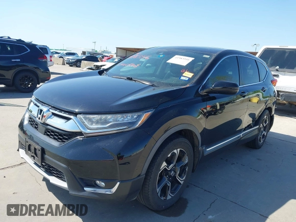 2018 Honda CR-V Touring with VIN 2HKRW2H91JH630702, listed as a IAAI auction lot 41983516 with 84,355 mi miles. Bid and sale history available at carsss.com. Image 2.