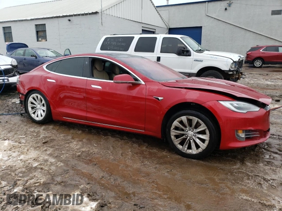 2017 Tesla Model S 100D with VIN 5YJSA1E29HF184387, listed as a Copart auction lot 39186144 with 101,387 mi miles and Salvage title. Bid and sale history available at DreamBid. Image 4.