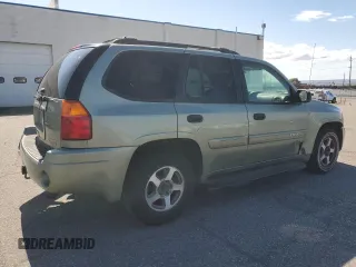 2004 GMC Envoy SLE with VIN 1GKDS13S442417232, listed as a Copart auction lot 51821225 with 242,945 mi miles and Salvage Title. Bid and sale history available at carsss.com. Image 3.
