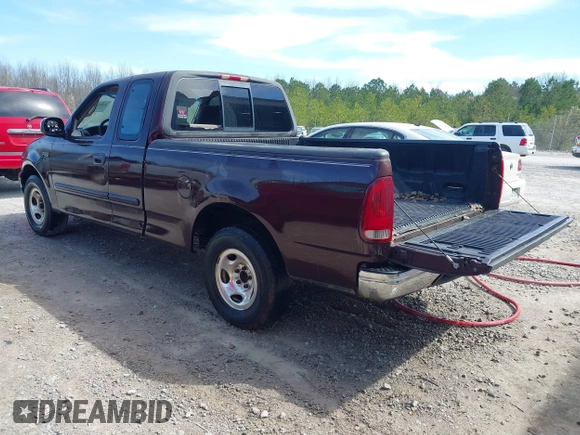 2000 Ford F-150 XL with VIN 1FTZX1725YNB34291, listed as a IAAI auction lot 41831745 with 207,119 mi miles. Bid and sale history available at carsss.com. Image 3.