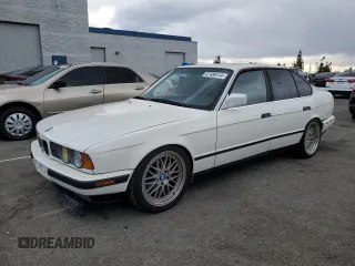1990 BMW 5 Series with VIN WBAHD1312LBF10005, listed as a Copart auction lot 87486414 with Not provided miles and Salvage title. Bid and sale history available at DreamBid. Image 1.