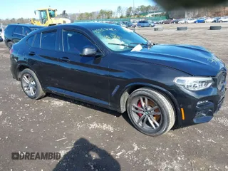 2021 BMW X4 M40i with VIN 5UX2V5C03M9H54824, listed as a IAAI auction lot 41817714 with 34,880 mi miles. Bid and sale history available at carsss.com. Image 1.