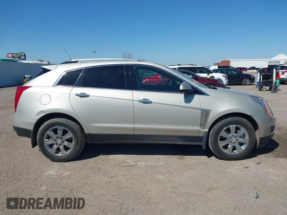 2015 Cadillac SRX Luxury Collection z VIN 3GYFNBE38FS641807, wystawiony jako IAAI lot #41669512 z przebiegiem 147 889 mil mil oraz . Historia ofert i sprzedaży dostępna na DreamBid. Obrazek 13.
