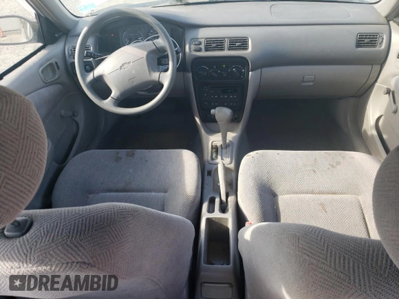 2001 Chevrolet Prizm z VIN 1Y1SK52811Z447352, wystawiony jako Copart lot #73916394 z przebiegiem 89 265 mil mil oraz Szkoda całkowita • Salvage title. Historia ofert i sprzedaży dostępna na DreamBid. Obrazek 8.
