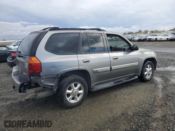 2005 GMC Envoy SLT with VIN 1GKDS13S852320018, listed as a Copart auction lot 80496544 with 237,451 mi miles and Salvage Title. Bid and sale history available at carsss.com. Image 3.