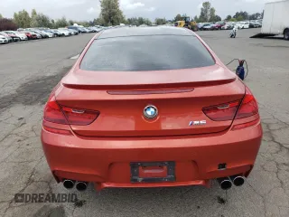 2014 BMW M6 z VIN WBSLX9C52ED160071, wystawiony jako Copart lot #77452554 z przebiegiem 64 814 mil mil oraz Szkoda całkowita • Salvage title. Historia ofert i sprzedaży dostępna na DreamBid. Obrazek 6.