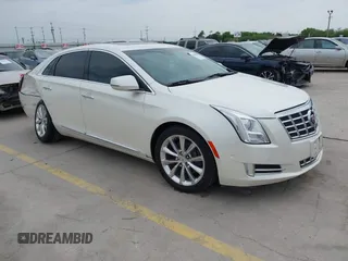 2014 Cadillac XTS Premium z VIN 2G61P5S33E9325844, wystawiony jako IAAI lot #42046808 z przebiegiem 81 242 mil mil oraz . Historia ofert i sprzedaży dostępna na DreamBid. Obrazek 1.