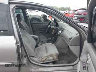 2002 Nissan Maxima GLE z VIN JN1DA31A32T308663, wystawiony jako IAAI lot #42136460 z przebiegiem 235 632 mil mil oraz . Historia ofert i sprzedaży dostępna na DreamBid. Obrazek 5.
