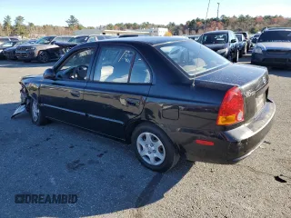 2005 Hyundai Accent GLS with VIN KMHCG45C15U662362, listed as a Copart auction lot 80574774 with 122,898 mi miles and Salvage Title. Bid and sale history available at carsss.com. Image 2.