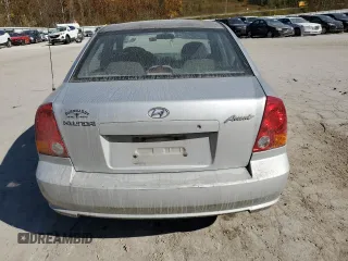 2005 Hyundai Accent GLS with VIN KMHCG45C75U638812, listed as a Copart auction lot 77968234 with 130,815 mi miles and Salvage Title. Bid and sale history available at carsss.com. Image 6.
