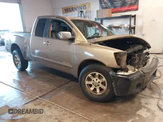 2004 Nissan Titan XE with VIN 1N6AA06A24N553627, listed as a IAAI auction lot 41427471 with 307,124 mi miles. Bid and sale history available at carsss.com. Image 1.