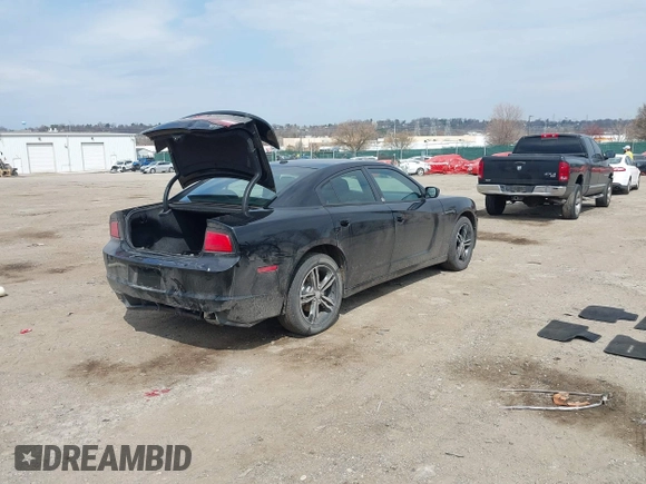2014 Dodge Charger SXT Plus with VIN 2C3CDXJG2EH184239, listed as a IAAI auction lot 41912384 with 128,313 mi miles. Bid and sale history available at carsss.com. Image 4.