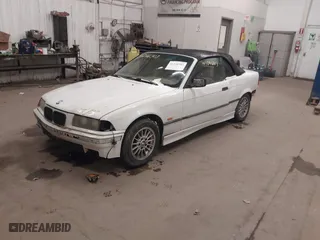 1997 BMW 3-Series 328IC with VIN WBABK832XVET95942, listed as a IAAI auction lot 41246303 with 165,825 mi miles. Bid and sale history available at carsss.com. Image 2.