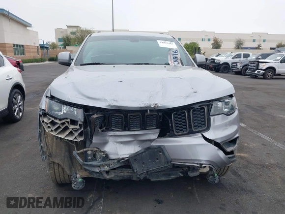 2016 Jeep Grand Cherokee Laredo z VIN 1C4RJFAG3GC457431, wystawiony jako IAAI lot #41993167 z przebiegiem 61 427 mil mil oraz . Historia ofert i sprzedaży dostępna na DreamBid. Obrazek 12.