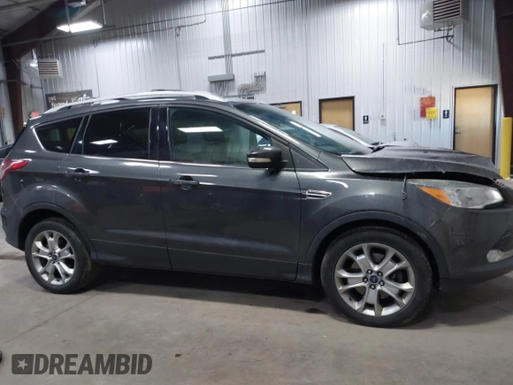 2016 Ford Escape Titanium with VIN 1FMCU9J90GUB35593, listed as a IAAI auction lot 42309020 with 173,019 mi miles and . Bid and sale history available at DreamBid. Image 13.