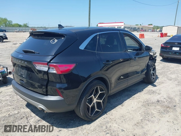 2021 Ford Escape SE z VIN 1FMCU0G66MUB26983, wystawiony jako IAAI lot #42144053 z przebiegiem 60 614 mil mil oraz . Historia ofert i sprzedaży dostępna na DreamBid. Obrazek 4.