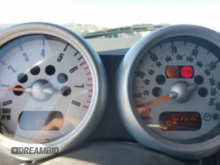 2006 MINI Hardtop z VIN WMWRC33506TJ73836, wystawiony jako Copart lot #57385905 z przebiegiem 105 592 mil mil oraz Szkoda całkowita • Salvage title. Historia ofert i sprzedaży dostępna na DreamBid. Obrazek 9.