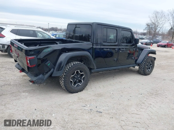 2022 Jeep Gladiator Rubicon with VIN 1C6JJTBG7NL145501, listed as a IAAI auction lot 41506842 with 20,593 mi miles and . Bid and sale history available at DreamBid. Image 4.
