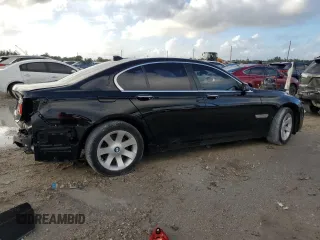 2011 BMW 7 Series 740i with VIN WBAKA4C59BC392351, listed as a Copart auction lot 84942304 with 76,874 mi miles and Salvage Title. Bid and sale history available at carsss.com. Image 3.