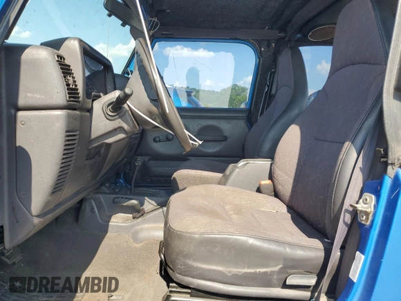 2002 Jeep Wrangler X with VIN 1J4FA39S92P776435, listed as a Copart auction lot 62792235 with 182,385 mi miles and Salvage title. Bid and sale history available at DreamBid. Image 7.