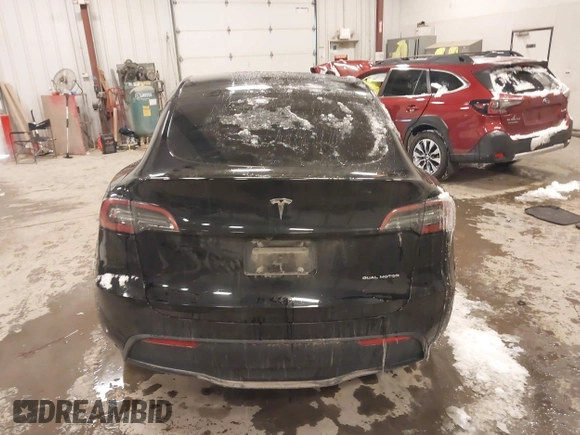 2024 Tesla Model Y Long Range with VIN 7SAYGDEEXRF085795, listed as a IAAI auction lot 41609867 with 57,049 mi miles. Bid and sale history available at carsss.com. Image 15.