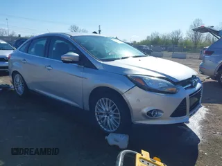 2014 Ford Focus Titanium with VIN 1FADP3J28EL354505, listed as a IAAI auction lot 42025966 with 104,868 mi miles. Bid and sale history available at carsss.com. Image 1.