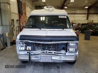 1990 GMC Vandura z VIN 1GDEG25K8L7521773, wystawiony jako Copart lot #84875104 z przebiegiem 171 457 mil mil oraz Tytuł czysty. Historia ofert i sprzedaży dostępna na DreamBid. Obrazek 5.