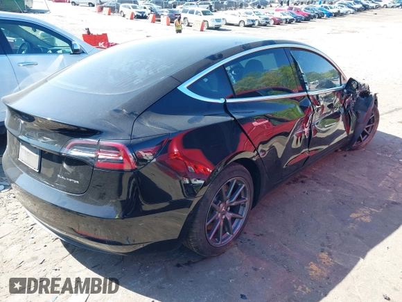 2020 Tesla Model 3 Long Range z VIN 5YJ3E1EB3LF622290, wystawiony jako IAAI lot #41978398 z przebiegiem 59 127 mil mil oraz . Historia ofert i sprzedaży dostępna na DreamBid. Obrazek 4.